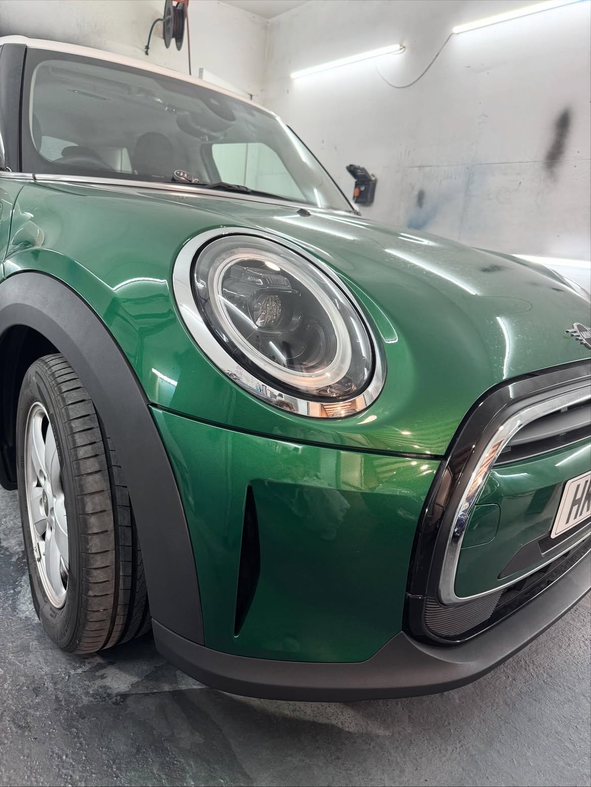Green Mini front wing after scratch and paint repair